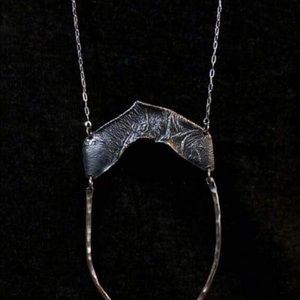 Hand crafted long silver necklace